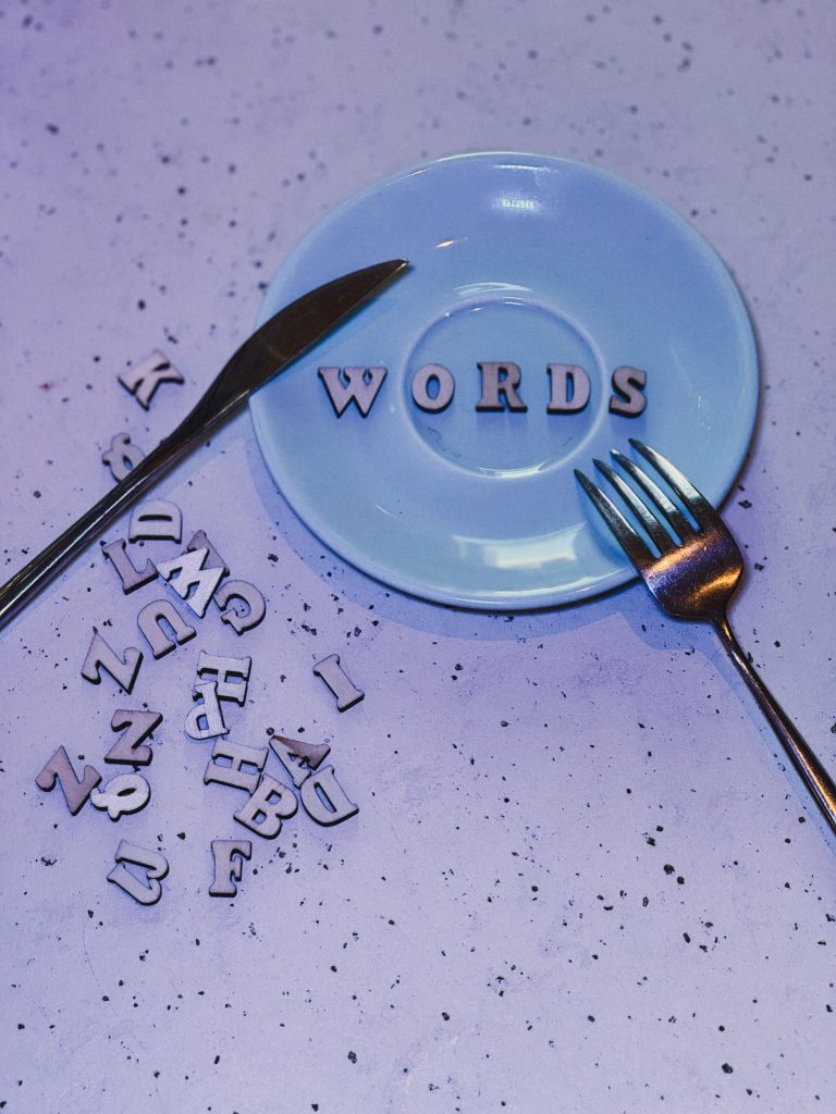 Artistic display of letters spelling 'WORDS' on a plate with creative layout, perfect for typography enthusiasts.